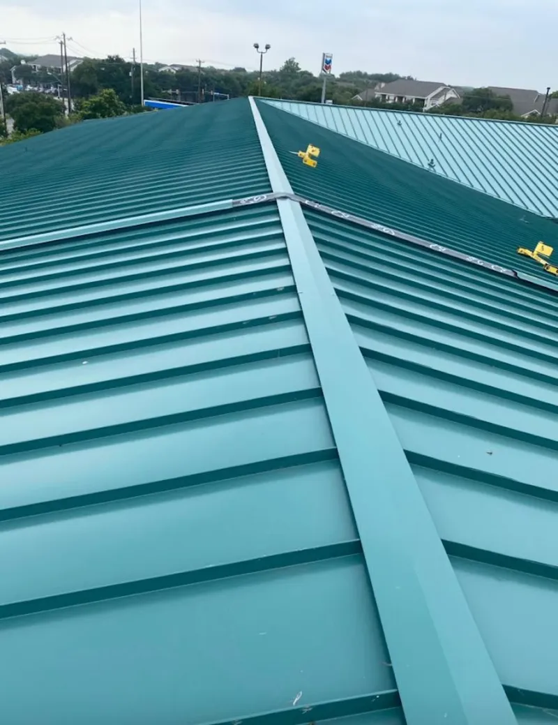Green commercial metal roof ridge and valley for Metal Roof Repair in Lake Alfred