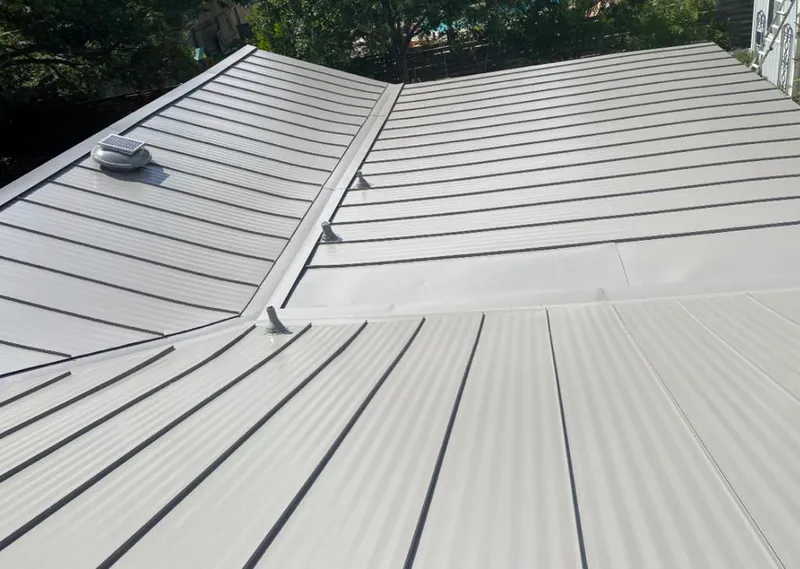Solar attic fan installed on a metal roof for Roof Ventilation in Lake Alfred